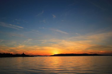 Hırvatistan 'da deniz üzerinde gün batımı