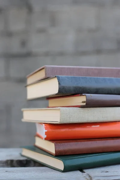 Books on a wooden box, books in an industrial setting