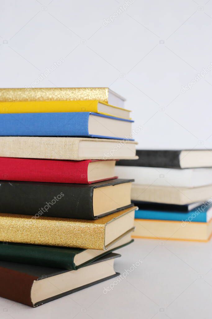 Stack of books on white background