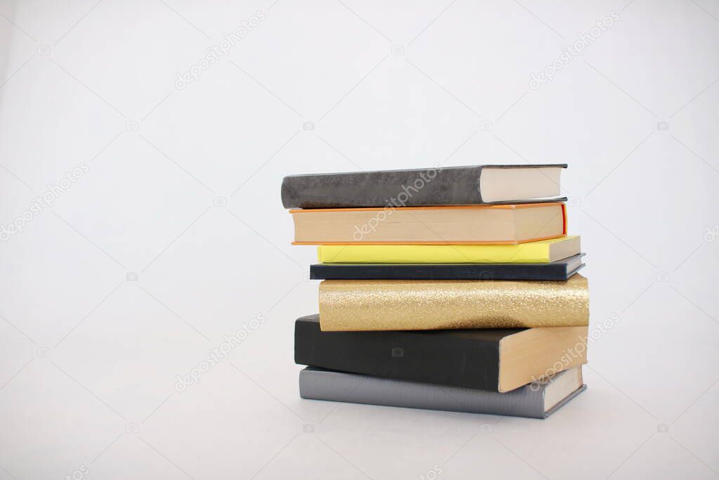 Stack of books on white background