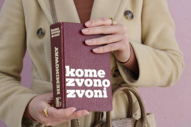 Makarska,Croatia,03.03.2021.A book by a famous writer in the hands of a young student