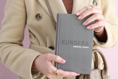 Makarska,Croatia,03.03.2021.A book by a famous writer in the hands of a young student