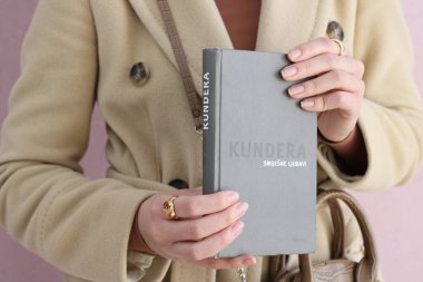 Makarska,Croatia,03.03.2021.A book by a famous writer in the hands of a young student