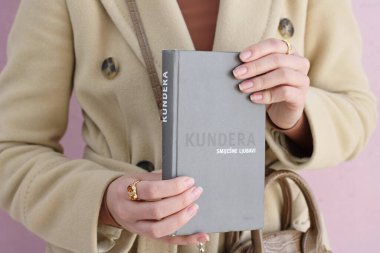 Makarska,Croatia,03.03.2021.A book by a famous writer in the hands of a young student