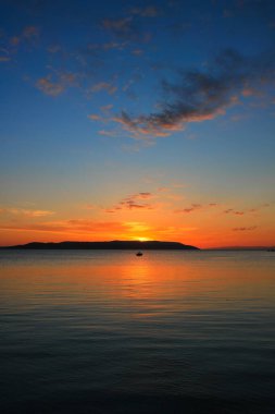 Sunset over the sea in Makarska clipart