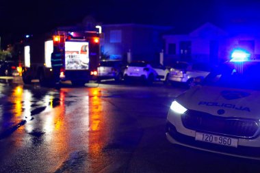 Split, Croatia, 07.10.2025. Night operation of Croatian police and firefighters at the scene, traffic accident, police car with a police car in the background.