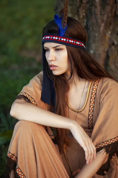 Front portrait of a young woman in native indian american boho dress walking in windy sunny day. — Stock Photo, Image