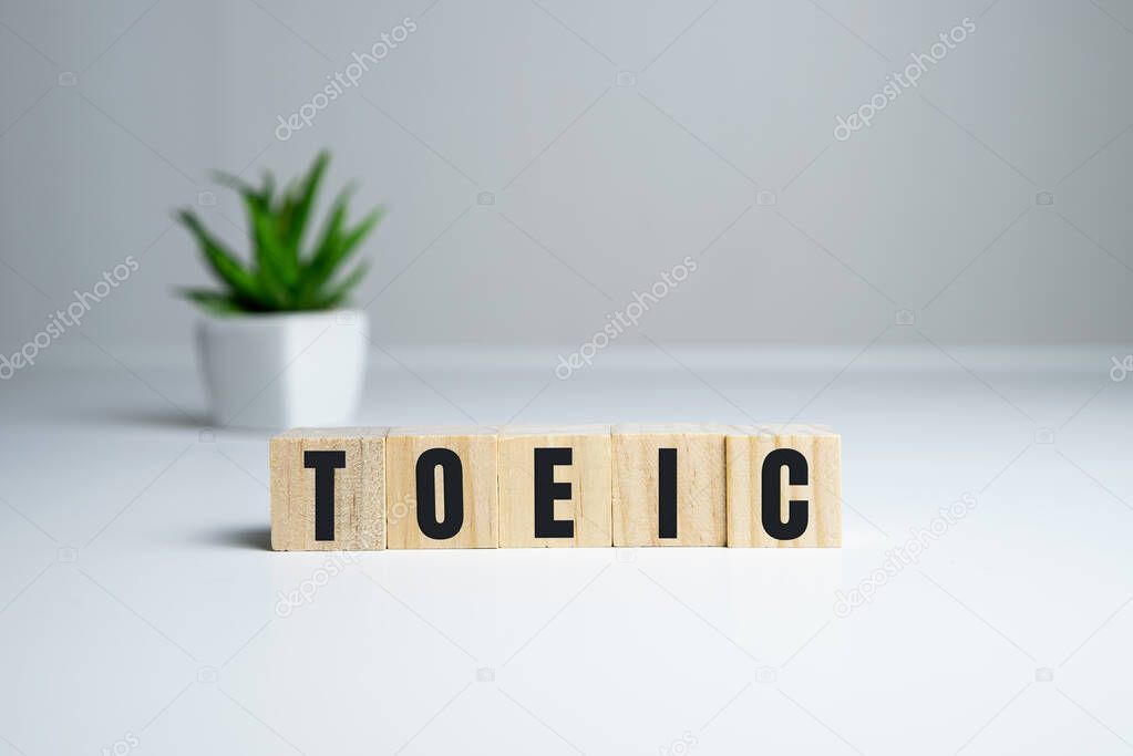 Toeic word on wooden cubes. Toeic concept