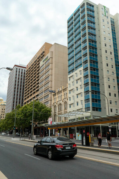A view of adelaide city from the buildings and businesses to the old artwork