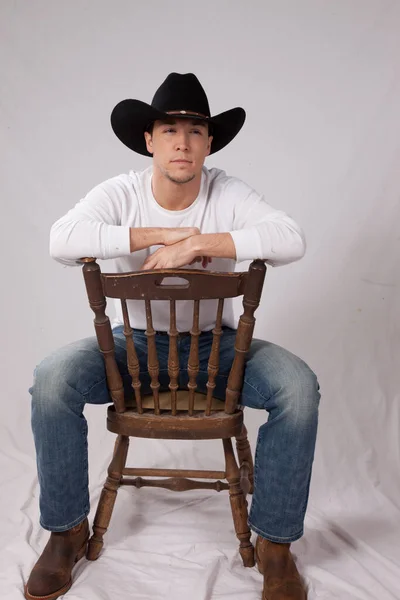 Pensive Cowboy Sitting Relaxed —  Fotos de Stock