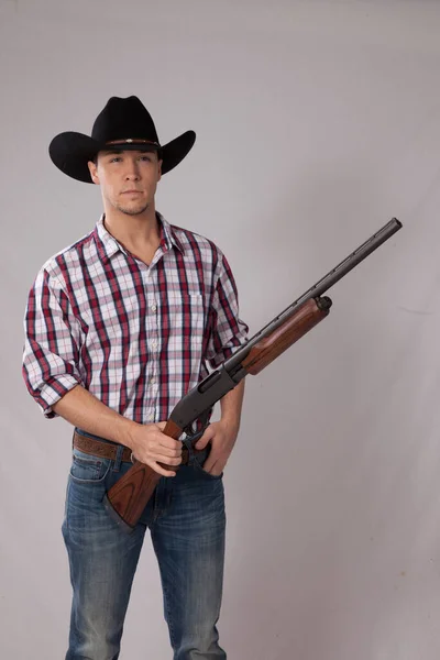 Pensive Cowboy Holding Shotgun — Stock fotografie