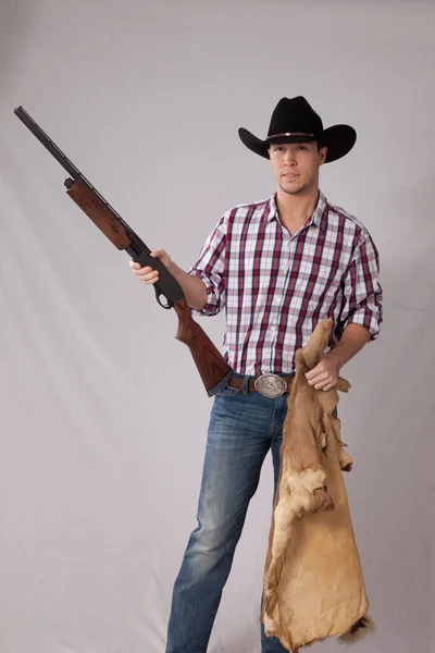 Pensive Cowboy Holding Shotgun —  Fotos de Stock