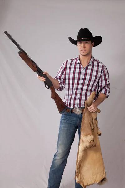 Pensive Cowboy Holding Shotgun — Stock fotografie