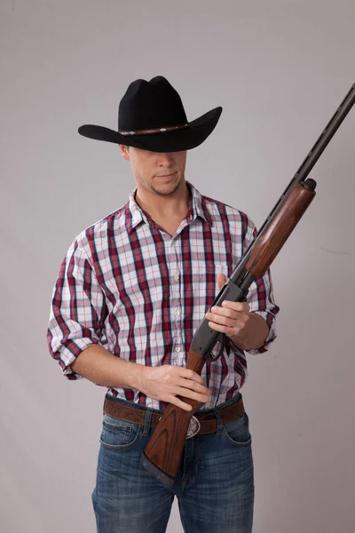 Pensive Cowboy Holding Shotgun Royalty Free Stock Photos