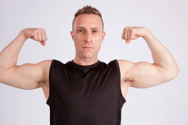 Handsome Man Flexing His Muscles — Stock Photo, Image