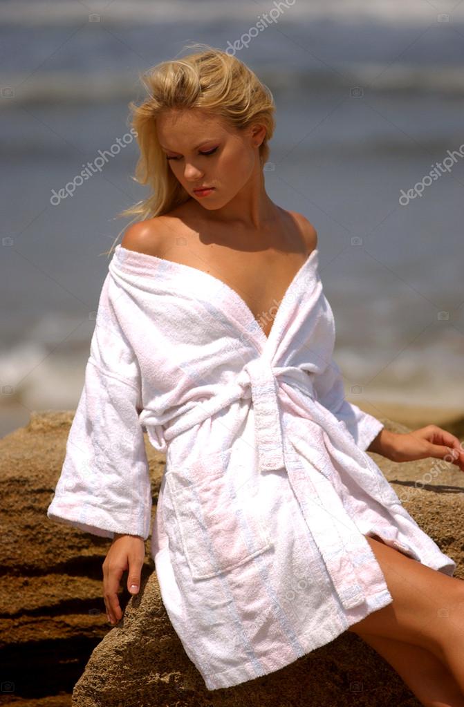 Pretty lady in white robe on vacation