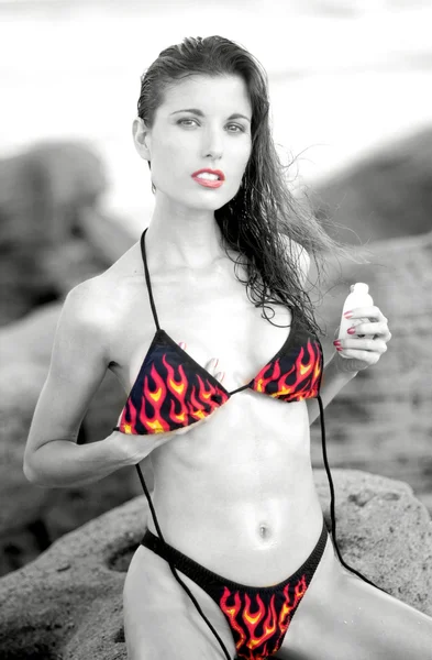 Black and White with Red and Yellow Flamed Skimpy Bikini sleek slim hour glass shape natural perky suggestive provocative beauty naughty college school girl pinup poster tight tone athletic sensual abdomen — Stock Photo, Image