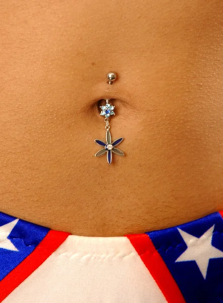 Pretty belly with piercing — Stock Photo, Image