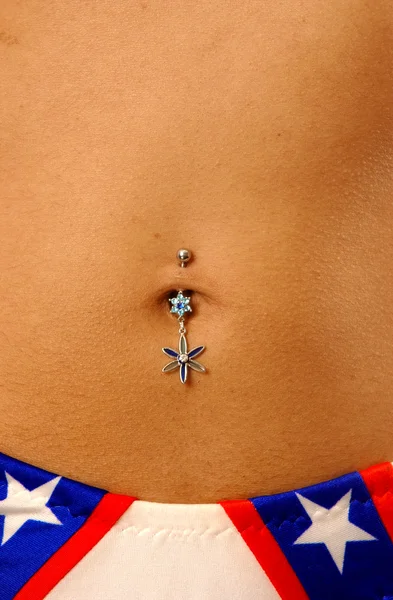 Pretty belly with piercing — Stock Photo, Image