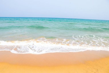 beautiful sandy beach and soft blue ocean wave, Blue ocean wave on sandy beach