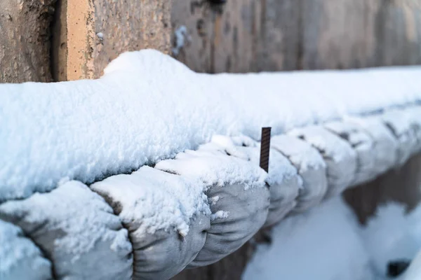 old heating pipe under the snow