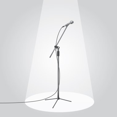 The microphone on the stage under the spotlights clipart