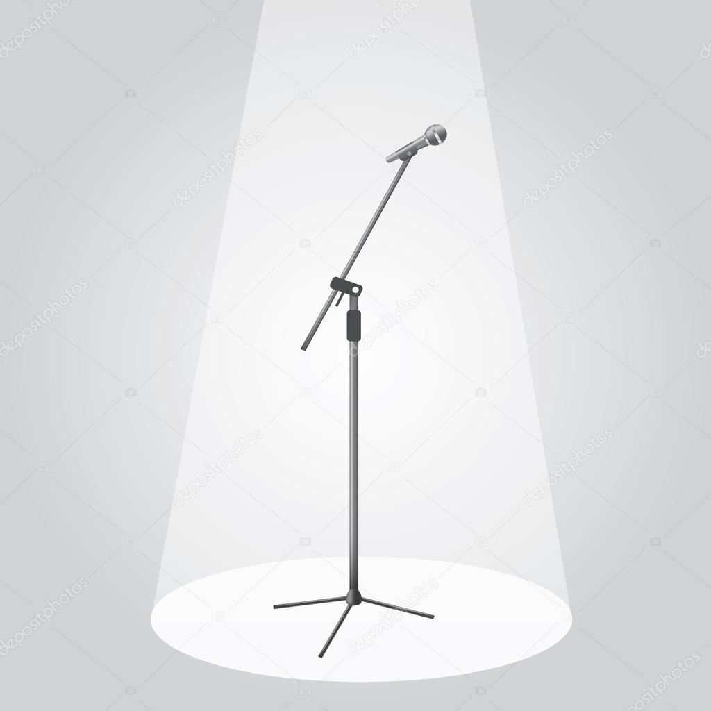 The microphone on the stage under the spotlights