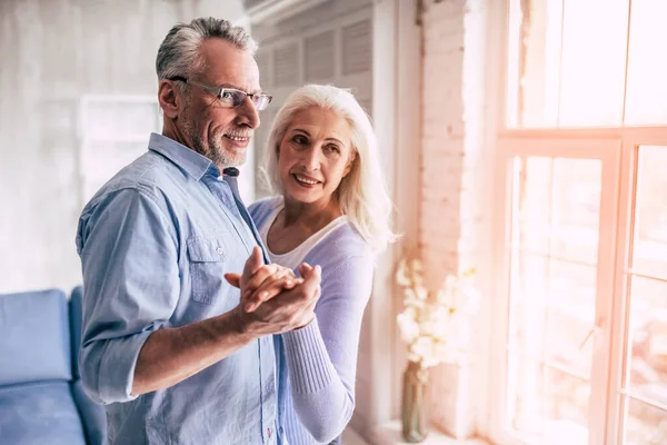 stock image The happy elderly woman and a man dancing