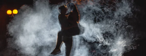 Man Lifting Woman Street Smoke Night Time — Stock Photo, Image