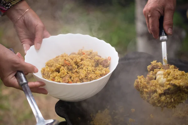 Pilaf, cooked outdoors — Stock Photo, Image