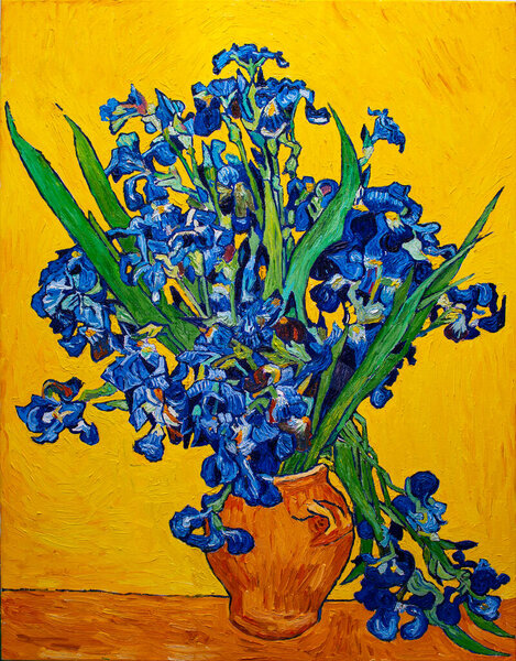 Oil painting on canvas. Vase with irises on a yellow background. Free copy based the famous painting by Vincent Van Gogh.