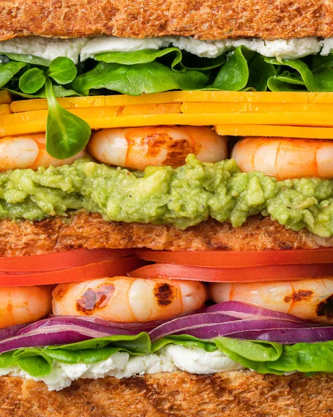 Club sandwich with shrimps, tomatoes, avocado. Creative photo.
