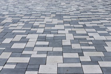 Sidewalk paved with rectangular white and gray tiles in perspective clipart