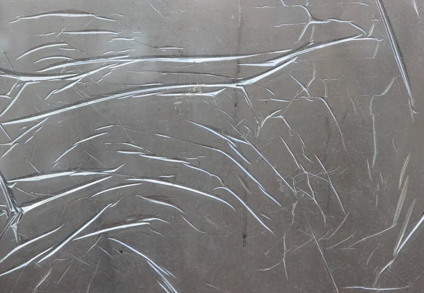 Gri yüzey ince, şeffaf, koruyucu bir filmle kaplı.