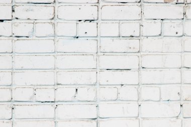 Beyaza boyanmış eski bir tuğla duvarın dokusu