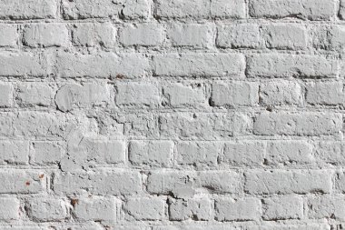 Beyaza boyanmış eski bir tuğla duvarın dokusu