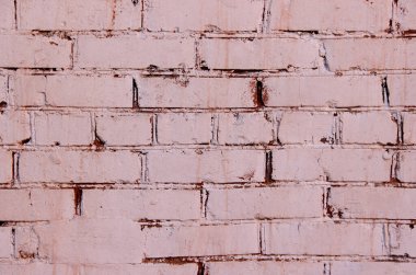 Kırmızı ve pembe boyayla kaplanmış tuğla duvar dokusu.