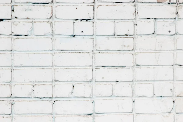 Beyaza boyanmış eski bir tuğla duvarın dokusu