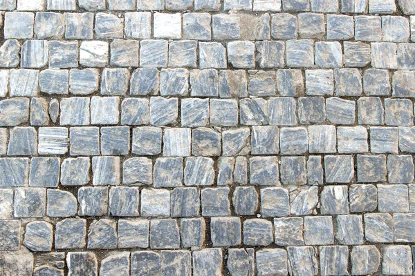 正方形の花崗岩のブロックで石畳の古い石畳 — ストック写真