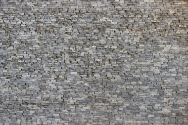 Dikdörtgen bloklardan yapılmış hasarlı eski bir duvarın dokusu