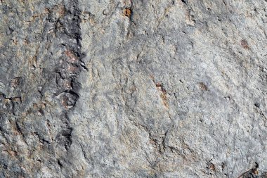 Arkaplan olarak gri doğal bir taşın dokusu