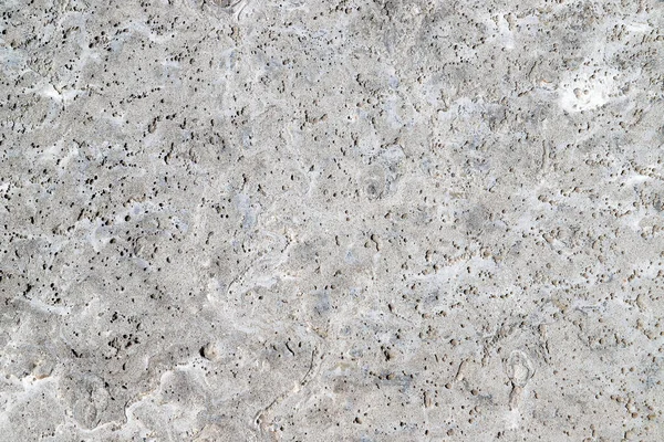 Arka plan olarak doğal taştan yapılmış eski bir duvarın dokusu