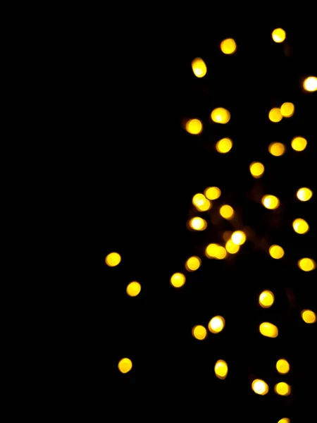 Золотые стороны или boke на черном фоне. Счастливого Рождества и счастливого Нового года. Рождественский фон. — стоковое фото