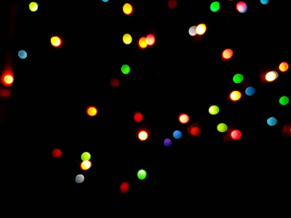 Разноцветные борта или бока на черном фоне. Счастливого Рождества и счастливого Нового года. Рождественский фон. — стоковое фото