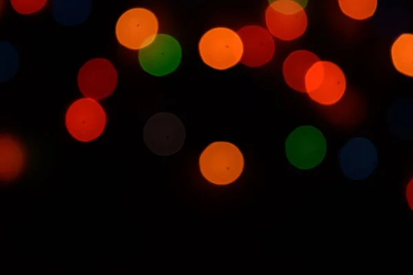 Разноцветные борта или бока на черном фоне. Счастливого Рождества и счастливого Нового года. Рождественский фон. — стоковое фото