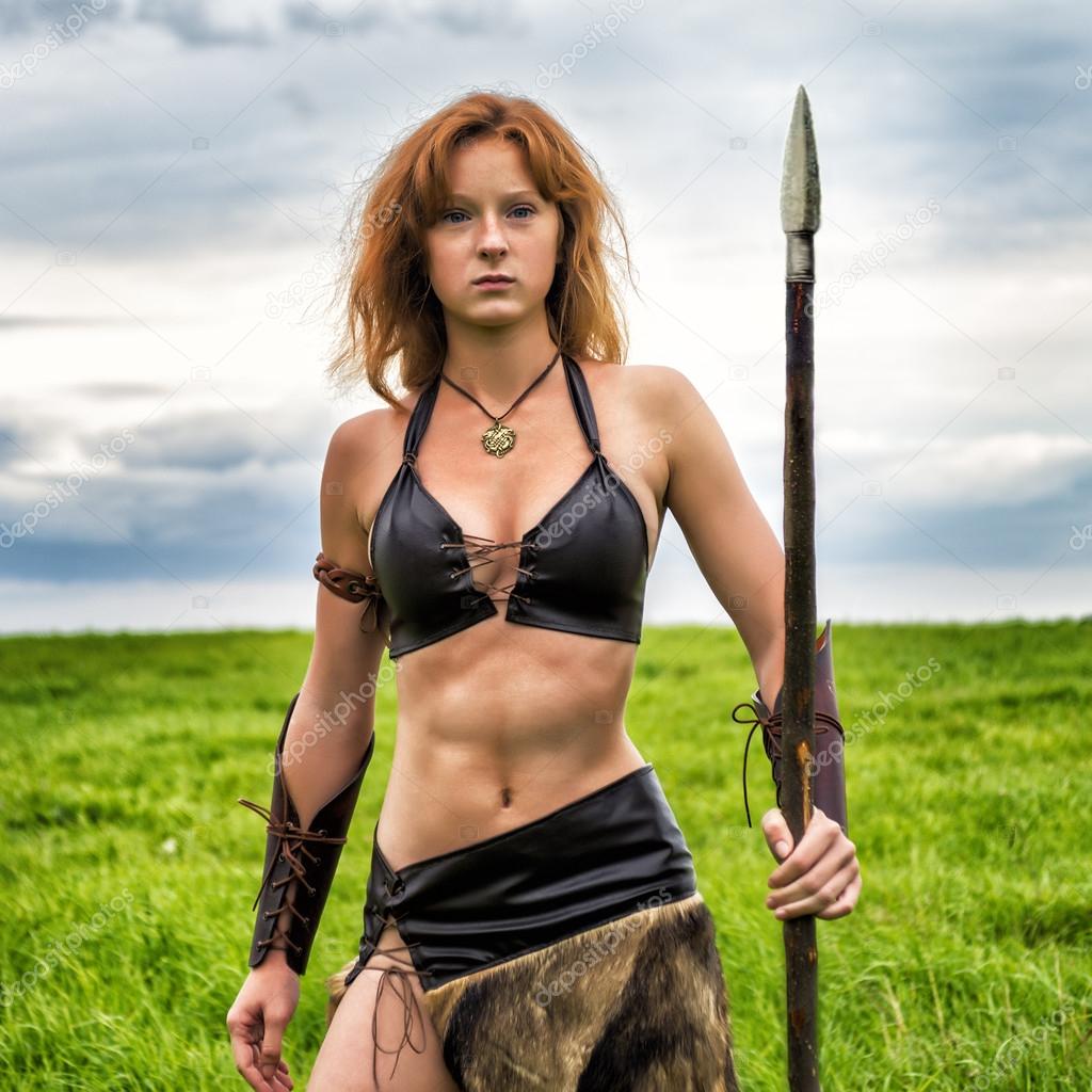 Girl warrior in the field. Amazon on patrol.
