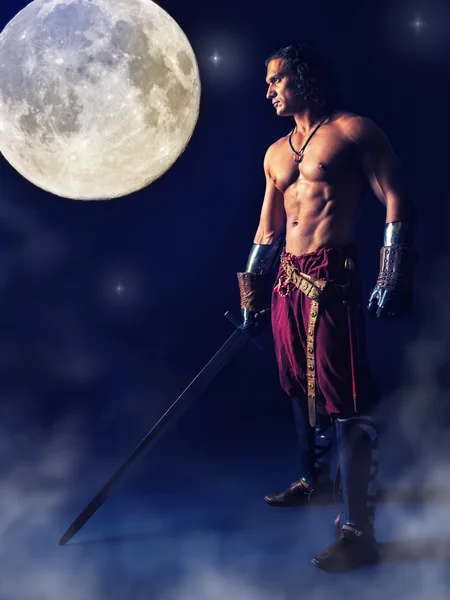 Half naked  warrior with a sword in the mystic background — Stock Photo, Image