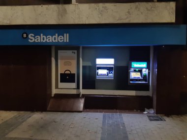 Ibi, Alicante, Spain - November 18th, 2020: Facade of a Sabadell bank office branch. Currently in a bank merger with BBVA group.