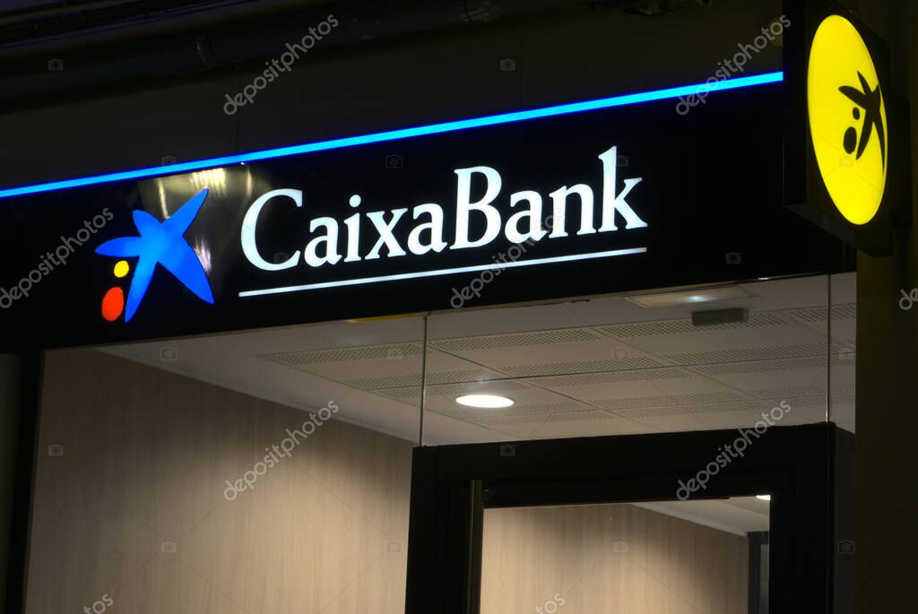 Ibi, Alicante, Spain - November 18th, 2020: Facade of a Caixabank bank branch office. Currently in a bank merger with Bankia group.