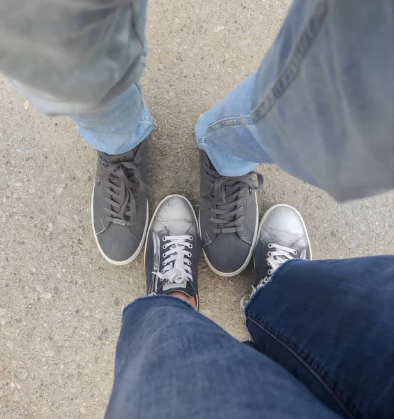 Two Pairs Feet Sneakers — Stock Photo, Image